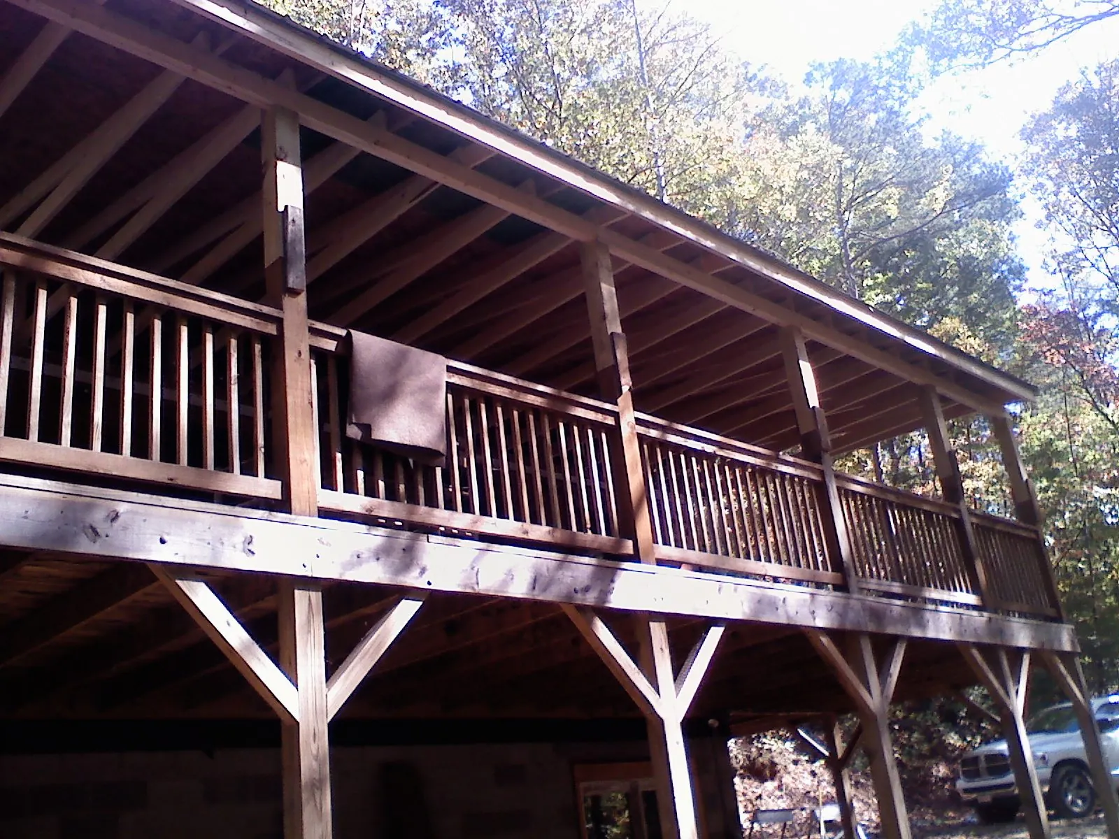 Timber framing under a new elevated porch and deck — Roof Leak Repair in Camden Wyoming by Roofing Brothers